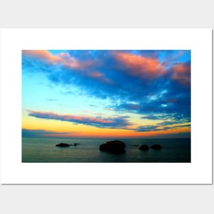 Dramatic sky over the sea with rocks Posters and Art